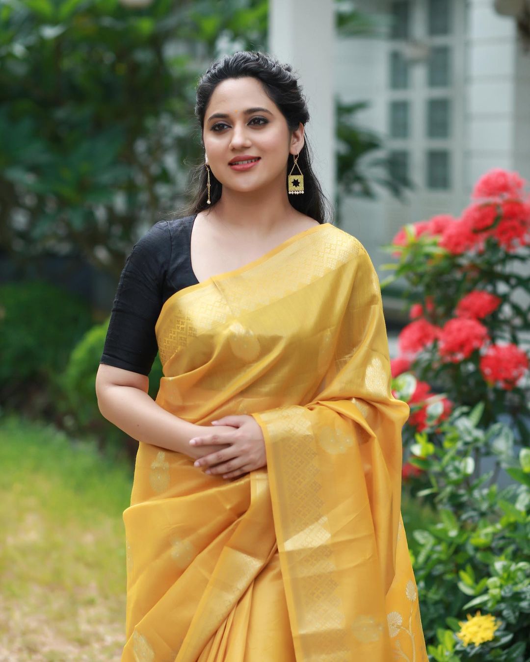 Malayalam Actress Miya George Stills in Yellow Saree Black Blouse